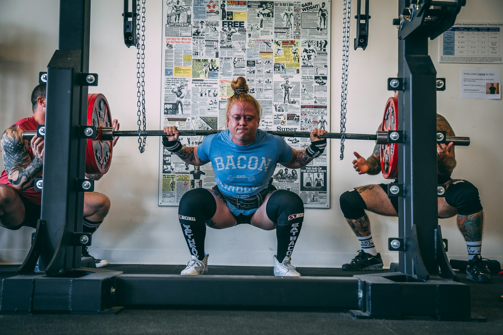 A lifter pausing mid-session, reflecting on stalled progress