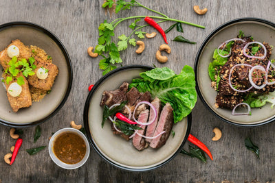 An Indian thali arranged around a central protein source